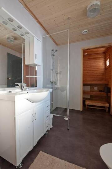 Фото номера Коттедж с сауной и 4 спальнями Дома для отпуска Kajaani Cottages г. Jormua 18