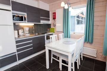 Фото номера Коттедж с сауной Дома для отпуска Kajaani Cottages г. Jormua 4